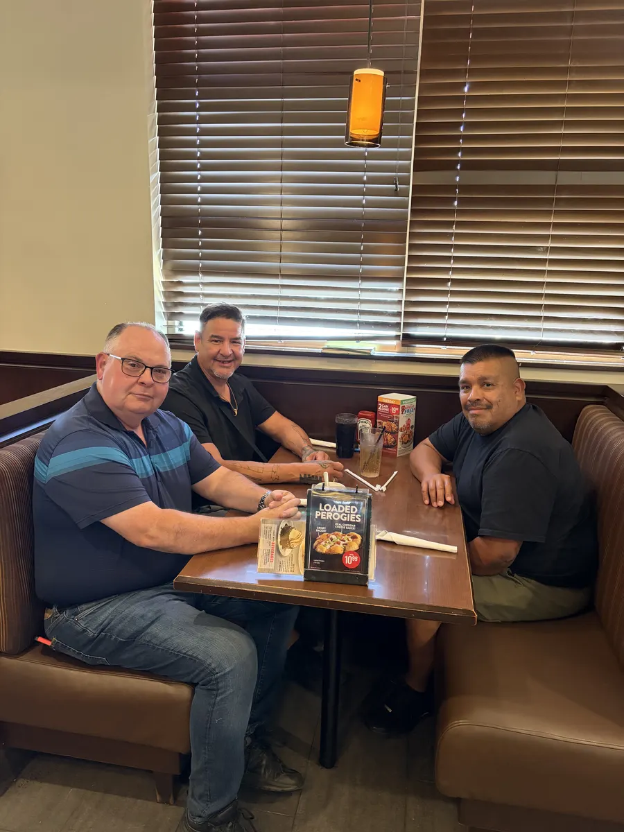 Three field team members seated together during the Northern Ontario visit