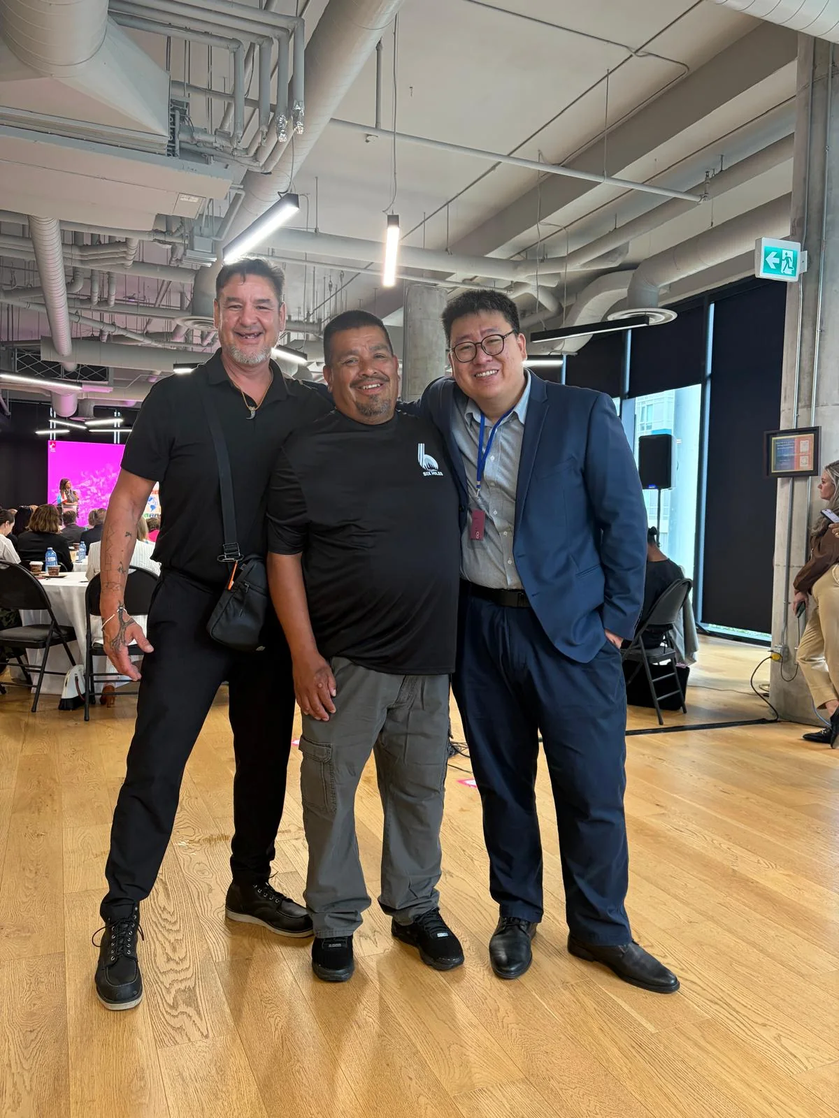Three people together at a community event